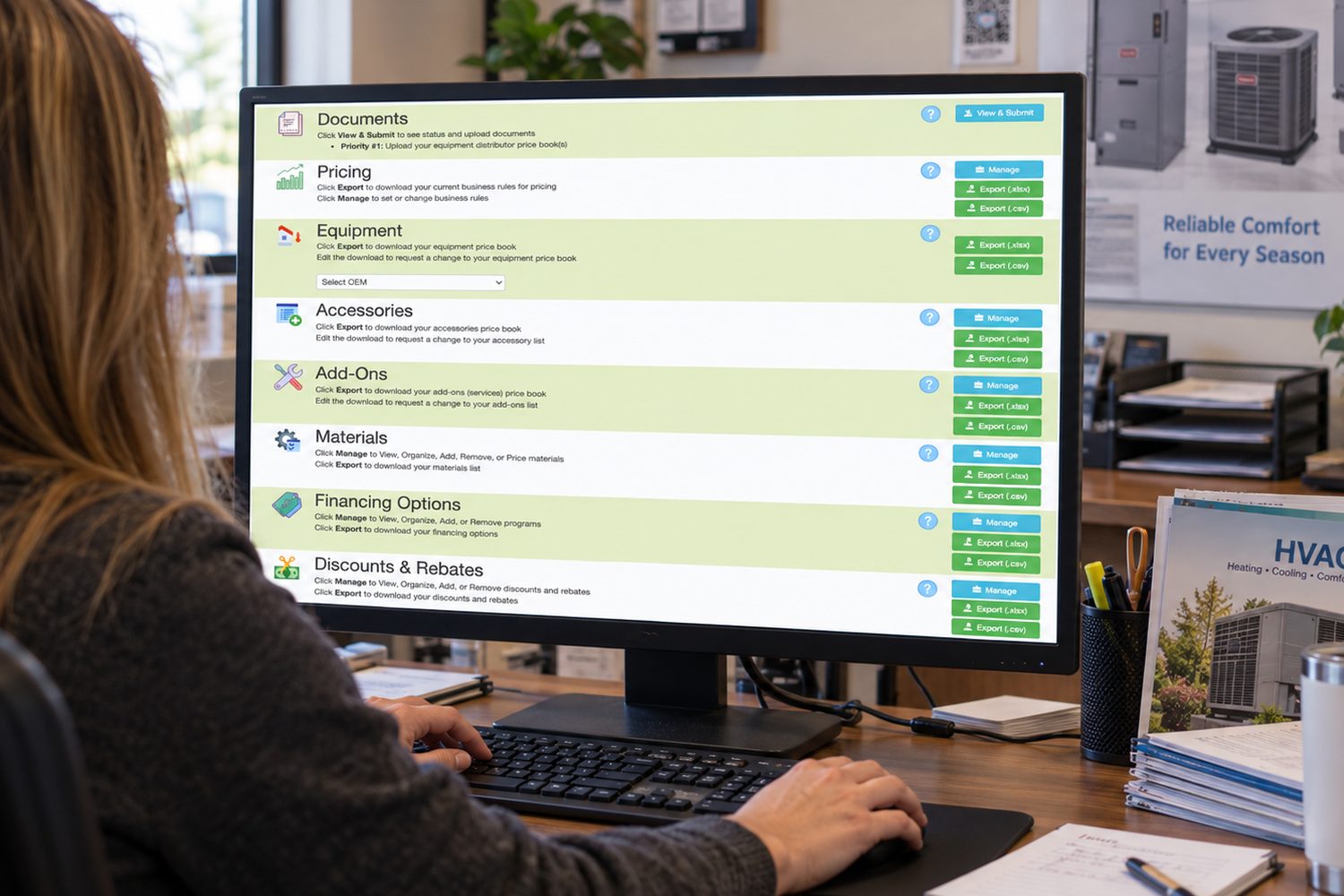 An office administrator at a PC with the Management Portal open in a browser
